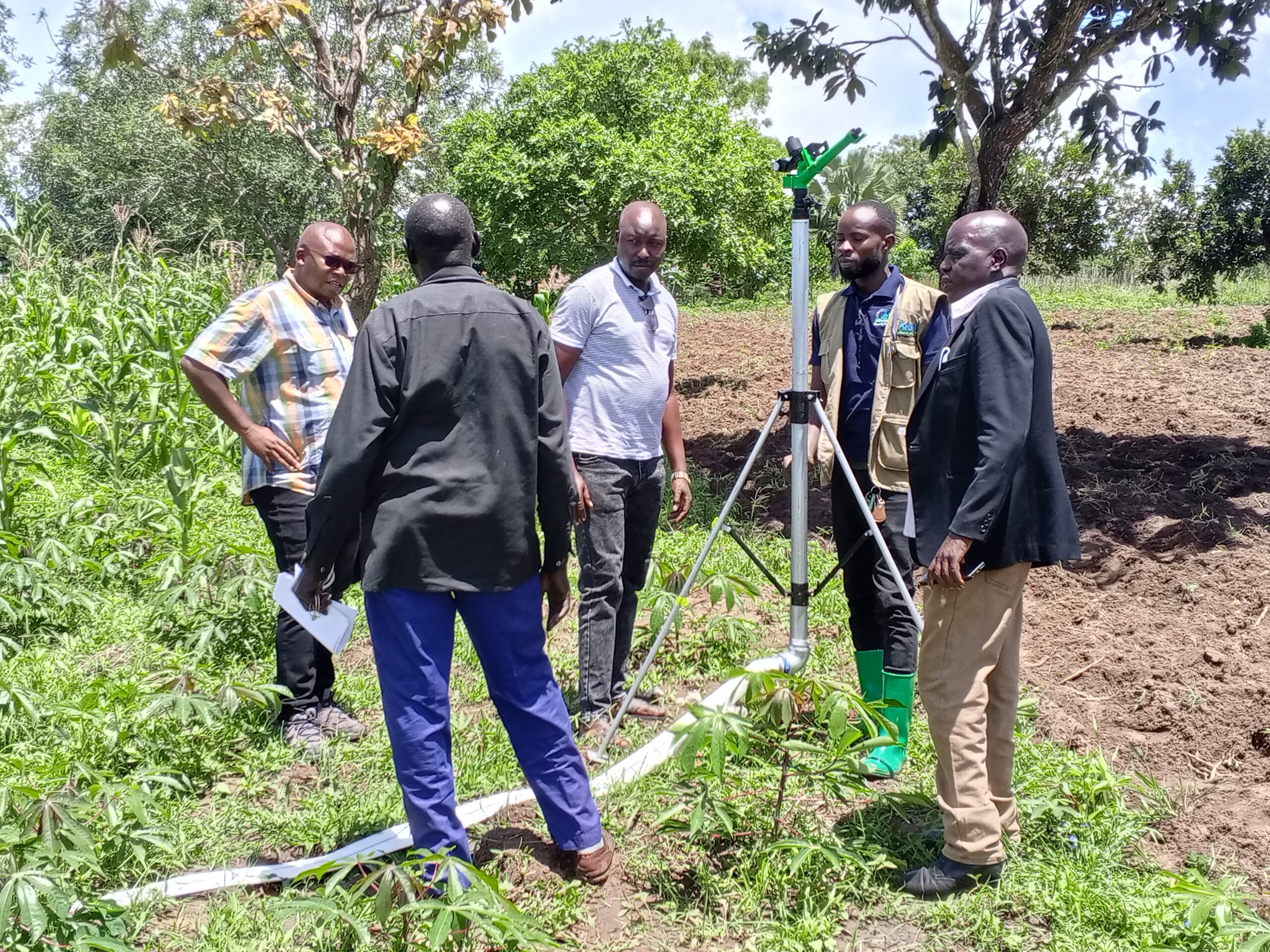 Community members participating in sustainable land management in Western Uganda